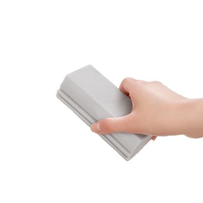 Hand using a multi-functional cleaning brush in a sink with text indicating its features.