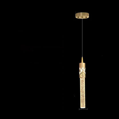 Gold pendant with measurements on a black background