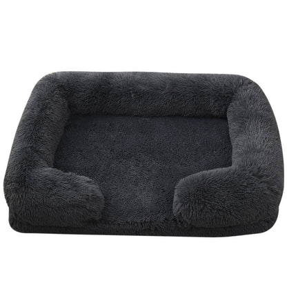 Dark gray pet bed with fluffy edges on a white background