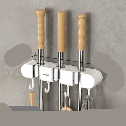 Three white hooks with wooden handles attached to a gray wall, showing measurements.