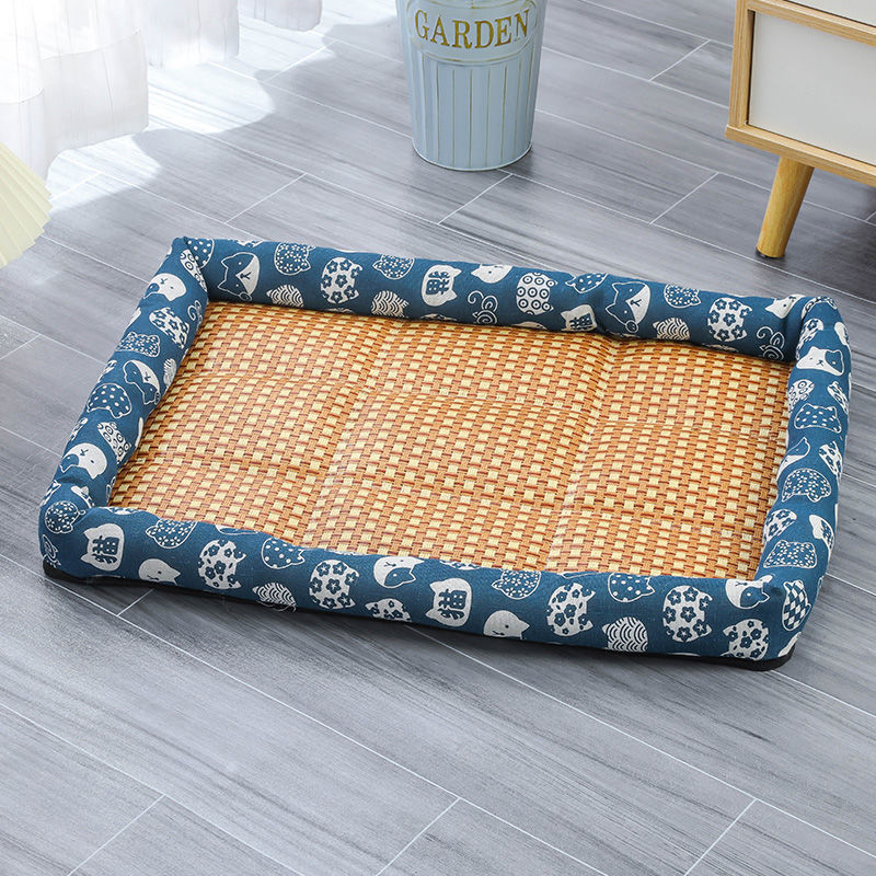 Pet bed with wicker design and blue patterned cover on a wooden floor.