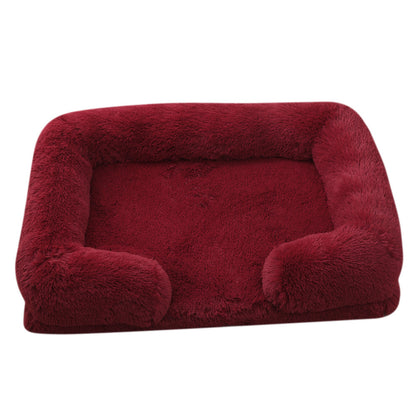 Red fluffy pet bed on a white background