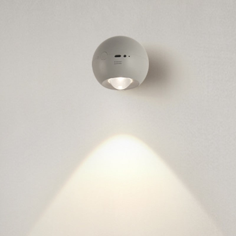 Wall-mounted light fixture on a plain wall