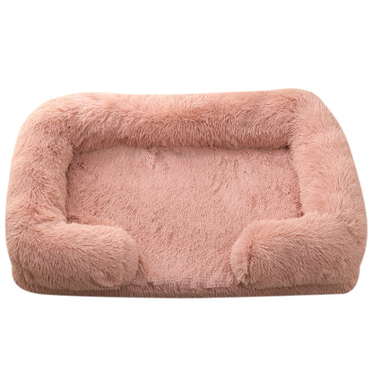 Pink fluffy pet bed on a white background