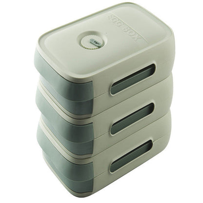 Stack of green plastic containers with a lid on a white background