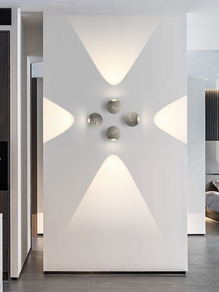 Modern interior design with geometric wall lights and a minimal color palette.