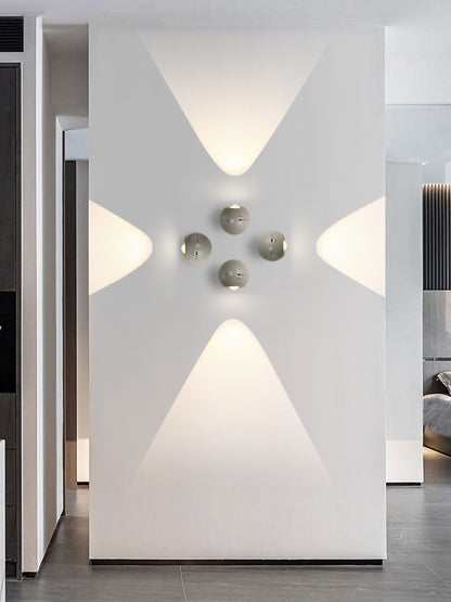 Modern interior design with geometric wall lights and a minimal color palette.