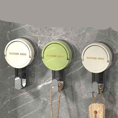 Three suction cup hooks on a marble wall with text describing their features.