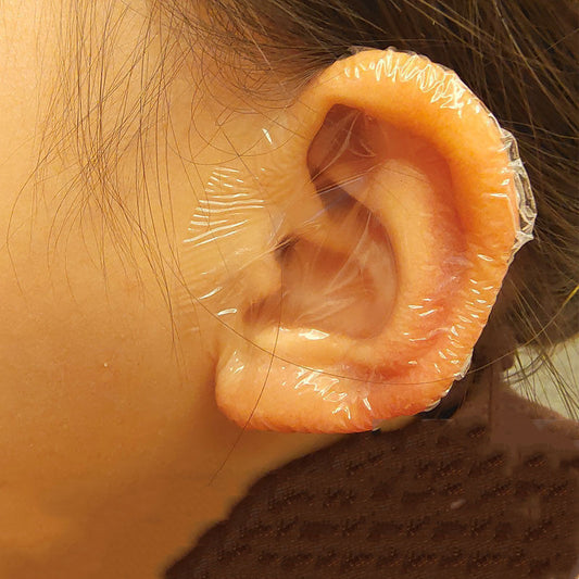 Ear with clear plastic wrap around it