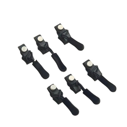 Set of six black hair clip retainers on a white background
