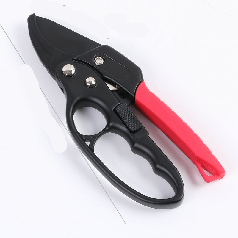Gardening shears with black blades and red handles on a white background
