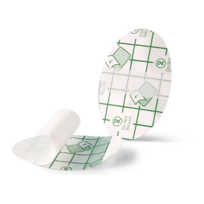 Two medical adhesive patches with green grid patterns on a white background